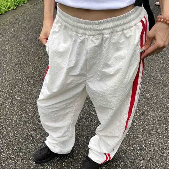 Fulfillment 2025 new European spring summer color block straight personality stripe patching wide-legged loose comfortable women's pants for wholesale